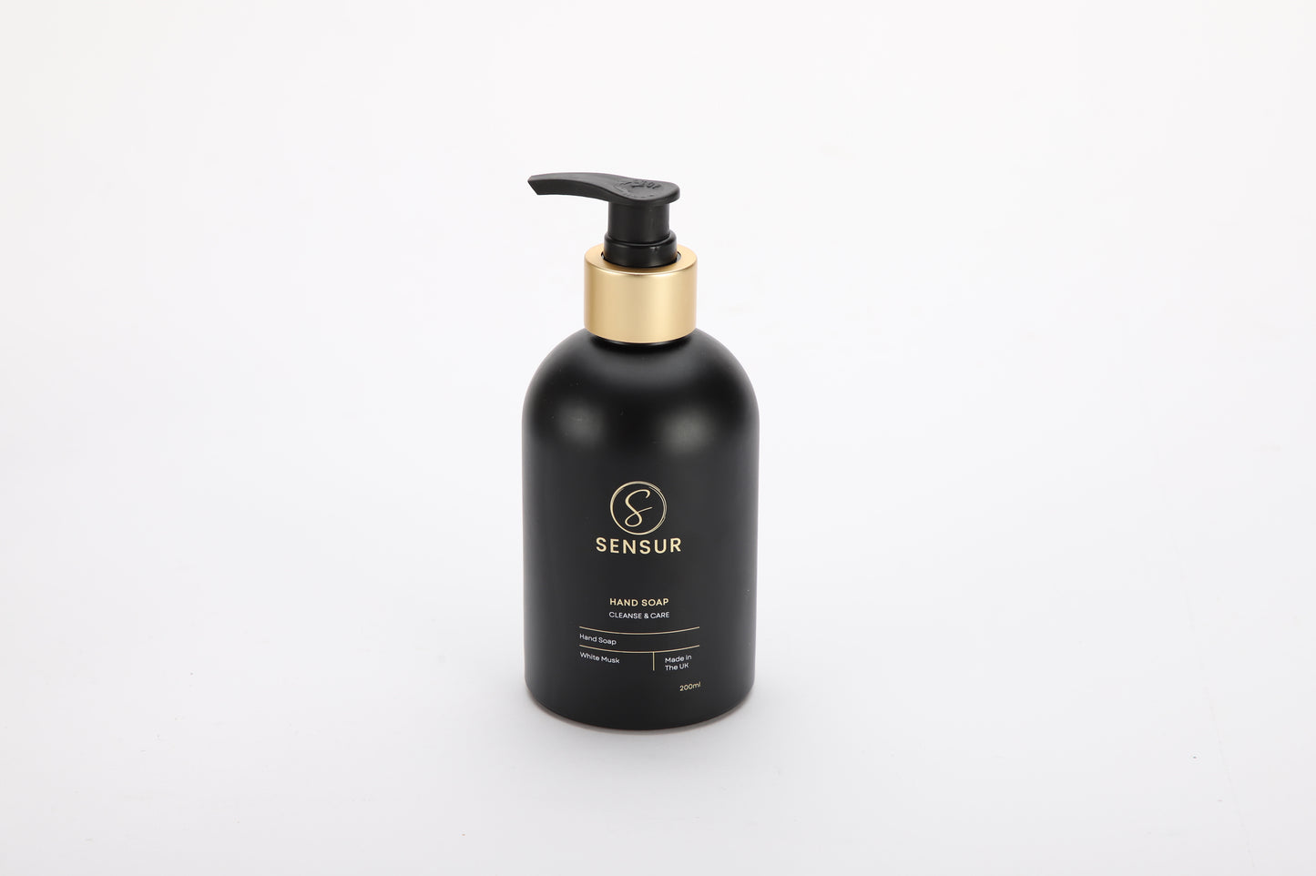 Black hand soap bottle with pump on a white background