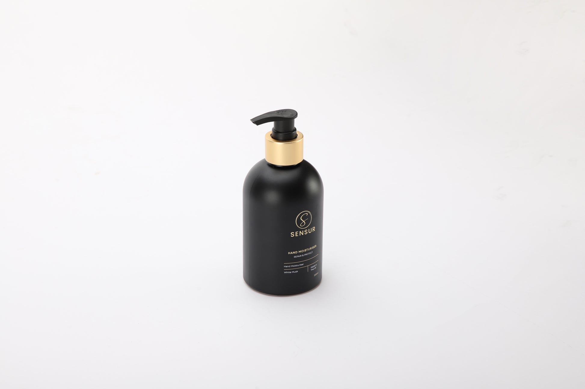 Black bottle with pump dispenser on a white background