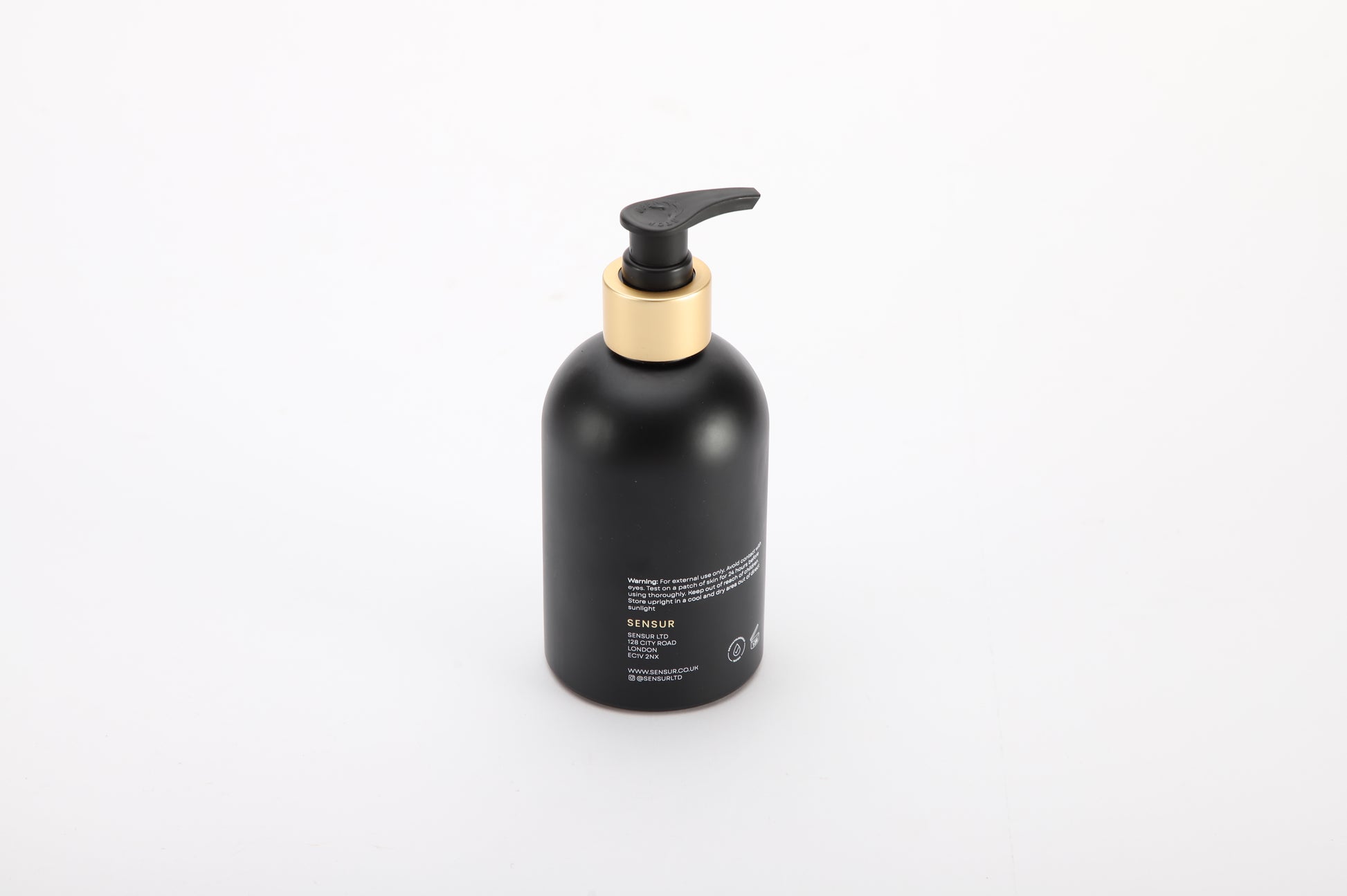 Black bottle with pump dispenser on a white background